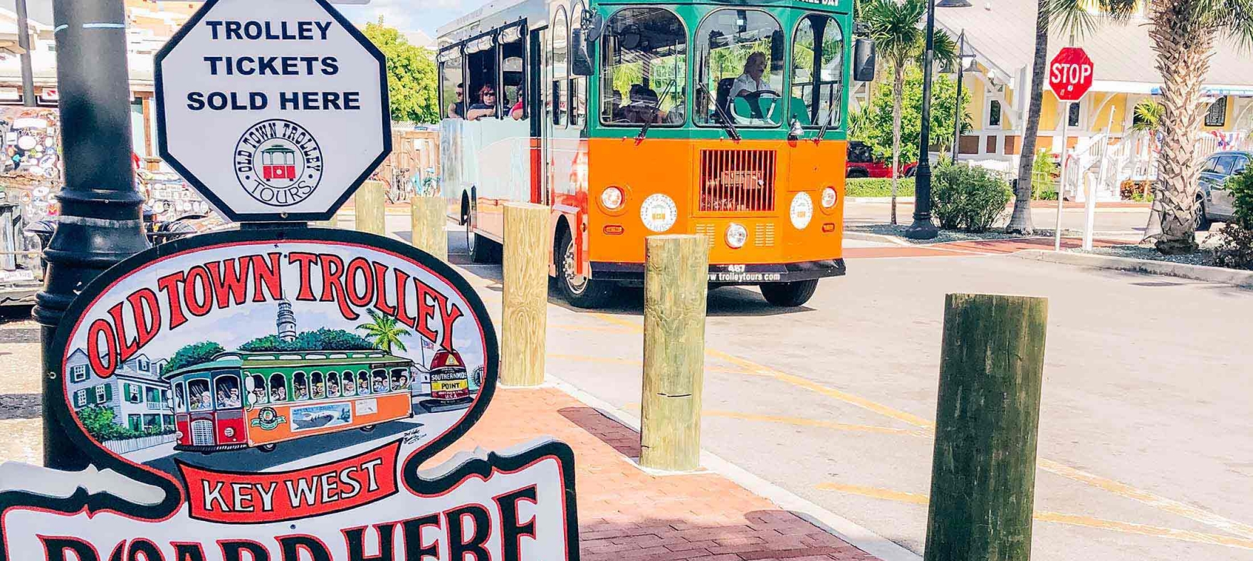 A picture of the Old Town Trolley and the Trolley Tickets signage.
