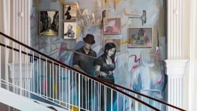 A mural of a wan and woman walking down the stairs next to a wooden staircase