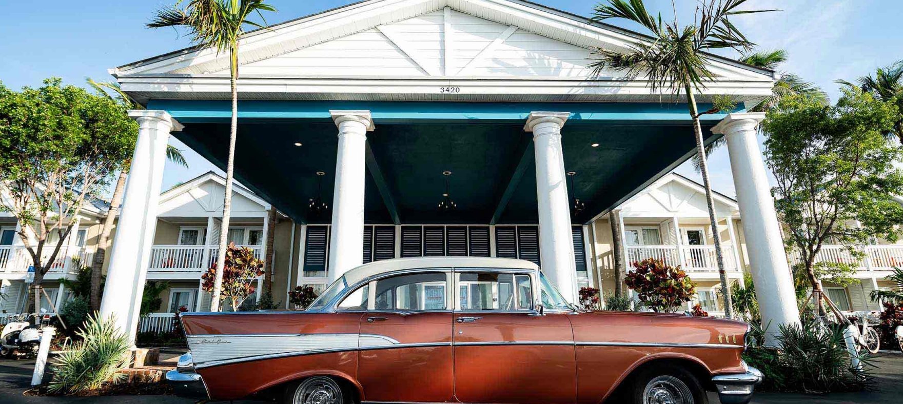 A classic car parked in front of the Havana Cabana building