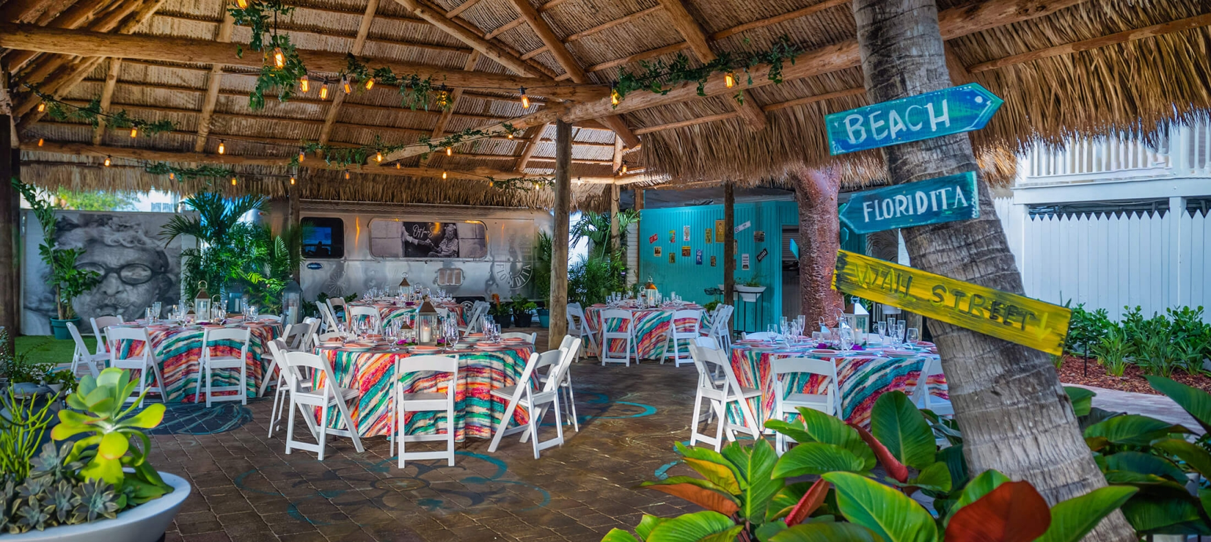 The dining area decor and layout in the Tiki Hut during an event