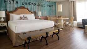 An interior view of Havana Cabana's mobility accessible rooms, equipped with a King bed and dining table.