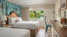 View of two queen beds in a Havana Cabana hotel room.