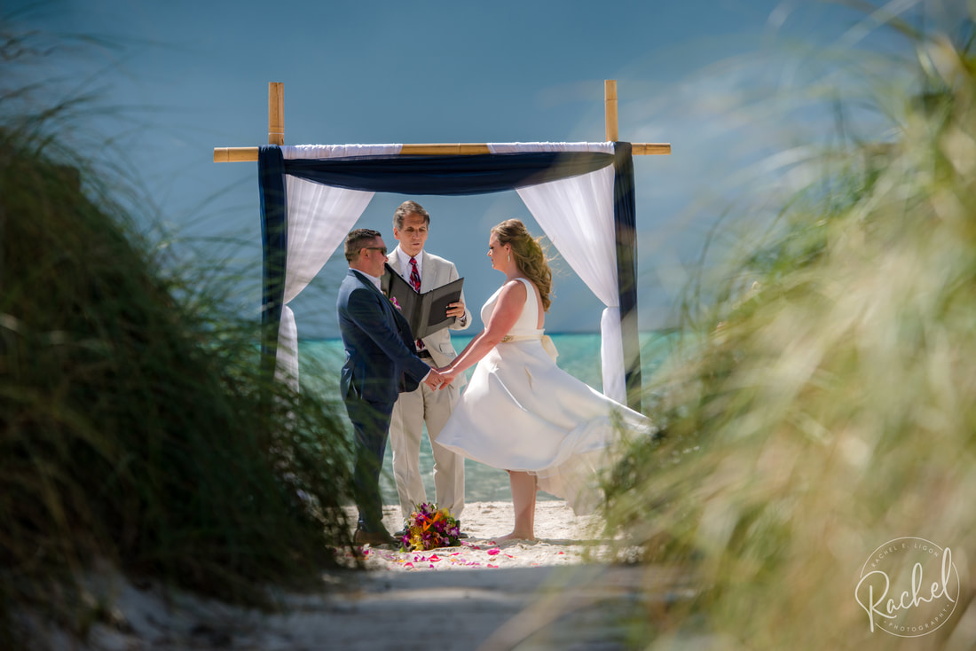 Man and woman standing at the alter on a beach in Key West.