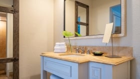 View of a white and sand colored bathroom vanity