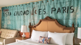 A view of an intricate headboard on a king bed at Havana Cabana.