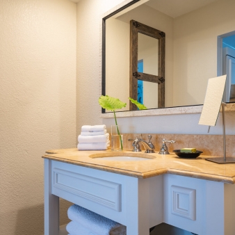 A view of the bathroom mirror and sink in the mobility accessible studio at Havana Cabana resort.