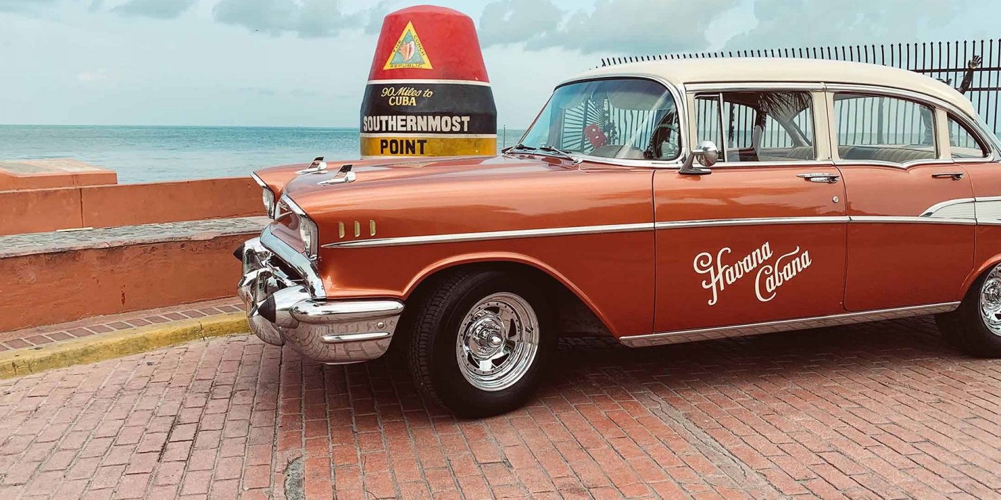 Havana Cabana's 1957 Chevrolet Bel Air 4-door Sedan parked outside Southernmost Point