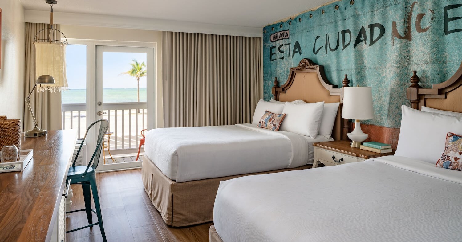 Interior view of a two Queens bedroom at Havana Cabana resort.