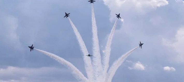 View of a few planes in the sky during an air show