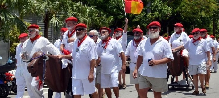 Group of uniformed men walking in a parade