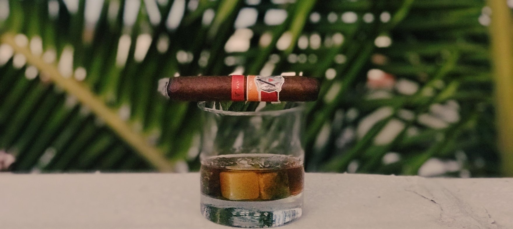 cigar on a glass of rum