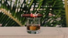 cigar on a glass of rum